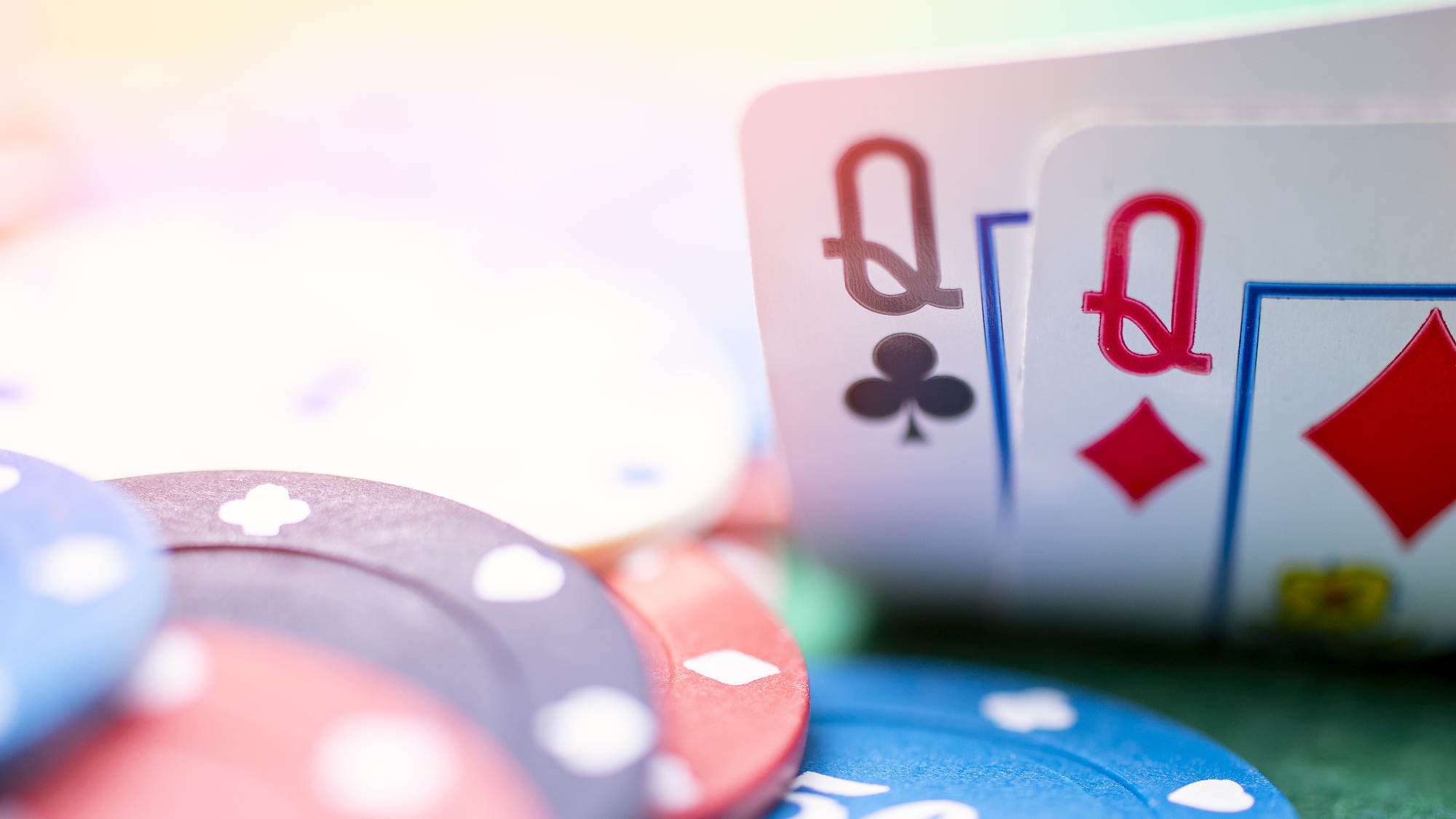 Two playing cards on the poker table.