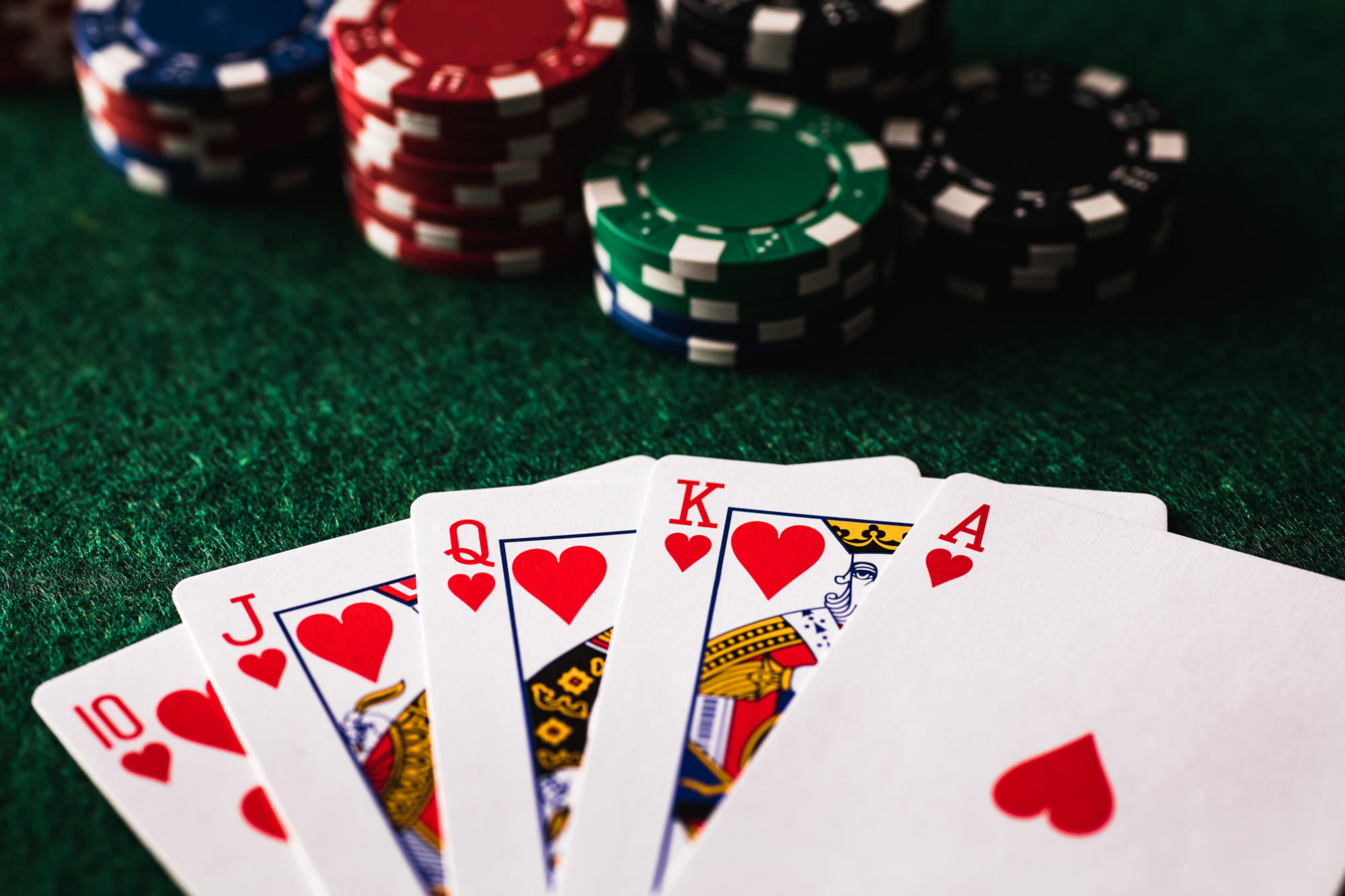 Poker table with Playing cards and Casino chips